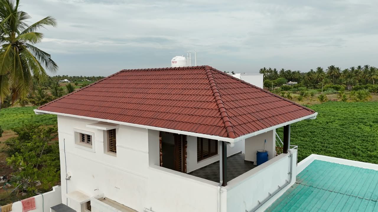 Two-storey house with a red clay tile hip roof